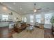 Inviting living area showcasing hardwood floors, comfortable seating, and a seamless connection to the kitchen and dining at 317 Catawba Branch Way, Moncks Corner, SC 29461