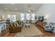 Bright living room with vaulted ceilings, hardwood floors, and stylish furniture arrangement at 317 Catawba Branch Way, Moncks Corner, SC 29461