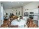 Open concept living space showcases kitchen, dining, and living areas in bright, modern home at 317 Catawba Branch Way, Moncks Corner, SC 29461