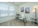 Bright home office with a glass desk, comfortable chair, and ample natural light at 317 Catawba Branch Way, Moncks Corner, SC 29461