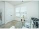 Bright home office with a glass desk, comfortable chair, and ample natural light at 317 Catawba Branch Way, Moncks Corner, SC 29461