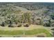 Expansive aerial view showcasing lush surroundings, golf course, and marsh views, highlighting the home's prime location at 3334 Cottonfield Dr, Mount Pleasant, SC 29466