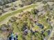 A bird's-eye view shows homes nestled among trees near a golf course at 3334 Cottonfield Dr, Mount Pleasant, SC 29466