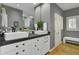 Modern bathroom features double sinks and white cabinetry at 3334 Cottonfield Dr, Mount Pleasant, SC 29466