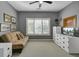 Neutral bedroom with a daybed, window shutters, and a white dresser with drawers and a TV at 3334 Cottonfield Dr, Mount Pleasant, SC 29466