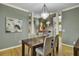 Elegant dining room featuring modern lighting, hardwood floors, and stylish decor at 3334 Cottonfield Dr, Mount Pleasant, SC 29466