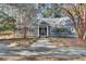 Charming home featuring a welcoming entrance with a blue door, manicured landscaping, and a well-maintained facade at 3334 Cottonfield Dr, Mount Pleasant, SC 29466