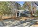 Well-maintained home with a circular driveway and mature landscaping at 3334 Cottonfield Dr, Mount Pleasant, SC 29466