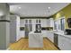 Bright kitchen featuring white cabinetry, stainless steel appliances, and a central island with a marble countertop at 3334 Cottonfield Dr, Mount Pleasant, SC 29466