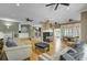 Spacious living room featuring hardwood floors, a fireplace, and a connected kitchenette area at 3334 Cottonfield Dr, Mount Pleasant, SC 29466