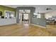 Bright and airy open floor plan with hardwood floors connecting the kitchen, dining, and living areas at 3334 Cottonfield Dr, Mount Pleasant, SC 29466
