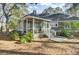 Home's rear screened-in porch surrounded by trees and foliage at 3334 Cottonfield Dr, Mount Pleasant, SC 29466