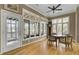 Bright sun room with hardwood floors, large windows, and a game table at 3334 Cottonfield Dr, Mount Pleasant, SC 29466