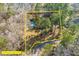 Aerial view emphasizing the backyard, including the pool and the property boundaries surrounded by trees at 405 Huntington Rd, Summerville, SC 29483