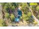 Aerial view showing the home, pool, and surrounding land, highlighting the property's layout and size at 405 Huntington Rd, Summerville, SC 29483