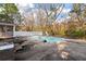 Backyard featuring an in-ground pool, patio furniture, and surrounded by mature trees at 405 Huntington Rd, Summerville, SC 29483