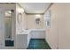 Vintage bathroom with dual sinks, and stylish vintage wallpaper accents at 405 Huntington Rd, Summerville, SC 29483