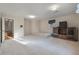 Large carpeted bonus room with windows, closet, and entertainment center, adjoining entrance at 405 Huntington Rd, Summerville, SC 29483