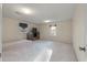 Large carpeted bonus room with windows, closet, and entertainment center at 405 Huntington Rd, Summerville, SC 29483