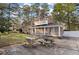 Outdoor patio with grill and picnic table, perfect for entertaining around this brick two-story home at 405 Huntington Rd, Summerville, SC 29483