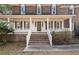 Close-up of the home's front entrance with brick stairs, showcasing its inviting curb appeal at 405 Huntington Rd, Summerville, SC 29483