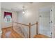 Upstairs hallway with a charming wooden staircase and neutral wall colors at 405 Huntington Rd, Summerville, SC 29483