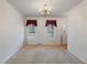 Spacious living room offers bright windows and neutral paint scheme at 405 Huntington Rd, Summerville, SC 29483
