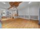 Open living room featuring hardwood floors, detailed trim work, ceiling fan, and stairway at 405 Huntington Rd, Summerville, SC 29483
