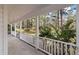 Relaxing porch view with a peaceful setting of the front yard surrounded by mature trees at 405 Huntington Rd, Summerville, SC 29483