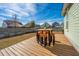 Wooden back deck furnished with a pub table set, perfect for entertaining at 411 Watergrass Way, Summerville, SC 29485