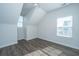 Bedroom with white walls, wood floors, and a window with natural sunlight at 411 Watergrass Way, Summerville, SC 29485