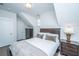 Bedroom with wood floors, brown dresser, full size bed, and white walls at 411 Watergrass Way, Summerville, SC 29485