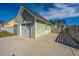 Detached two-car garage featuring a concrete driveway and charming exterior at 411 Watergrass Way, Summerville, SC 29485