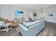 Cozy living room area with comfortable seating, TV, and open dining space at 411 Watergrass Way, Summerville, SC 29485