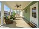 Relaxing screened porch with comfortable seating and views of the outdoor area at 411 Watergrass Way, Summerville, SC 29485