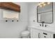 Modern bathroom featuring beadboard paneling, vanity, framed mirror and sleek fixtures at 415 Parkdale Dr # 8A, Charleston, SC 29414