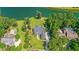 Breathtaking aerial view showcases an estate home with a gorgeous pool and surrounding landscaping at 4162 Ten Shillings Way, Hollywood, SC 29470