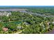 Aerial view of a luxurious property with waterfront access, lush greenery, and serene surroundings at 4162 Ten Shillings Way, Hollywood, SC 29470