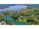 Beautiful aerial view of a home nestled among trees, showcasing waterfront location and expansive natural beauty at 4162 Ten Shillings Way, Hollywood, SC 29470