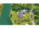 An aerial perspective of the property's expansive backyard with a lush landscape and a tranquil pond at 4162 Ten Shillings Way, Hollywood, SC 29470