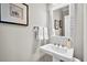 Elegant powder room featuring a pedestal sink, decorative mirror and classic fixtures at 4162 Ten Shillings Way, Hollywood, SC 29470