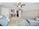 Bedroom featuring a ceiling fan, comfortable bed, and decorative bookshelf at 4162 Ten Shillings Way, Hollywood, SC 29470
