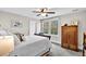 Bright bedroom features a ceiling fan, natural light, wardrobe and comfortable bed at 4162 Ten Shillings Way, Hollywood, SC 29470