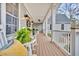 Charming front porch with rocking chairs, decorative plants, and a cozy atmosphere for outdoor relaxation at 4162 Ten Shillings Way, Hollywood, SC 29470