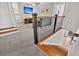 Bright upper hallway with a decorative railing, and a view of the Gathering room at 4162 Ten Shillings Way, Hollywood, SC 29470