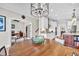 Open-concept dining area connects to a modern kitchen and cozy office space at 4162 Ten Shillings Way, Hollywood, SC 29470