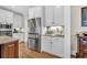 Kitchen with stainless steel refrigerator and white cabinets with modern hardware at 4162 Ten Shillings Way, Hollywood, SC 29470