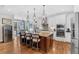 Open kitchen with a large center island, stainless steel appliances, and pendant lighting at 4162 Ten Shillings Way, Hollywood, SC 29470