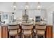 Bright kitchen island featuring granite countertops, seating, and pendant lighting at 4162 Ten Shillings Way, Hollywood, SC 29470