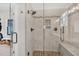 Modern shower with a glass door and tile surround at 4162 Ten Shillings Way, Hollywood, SC 29470